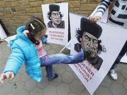 LittleGirlKicksPosterOfGaddafi LittleGirlKicksPosterOfGaddafi