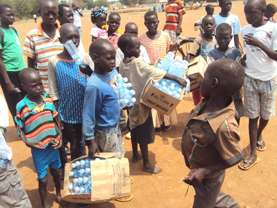Street children in Torit town of Eastern Equatoria, collecting empty plastic bottles for sale Street children in Torit town of Eastern Equatoria, collecting empty plastic bottles for sale