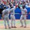 Kevin Youkilis (left) and Adrian Gonzalez (centre) congratulate David Ortiz (right) on his homerun for the Red Sox in the 5th inning