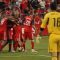 Whitecaps goalkeeper Jay Nolly watches TFC players celebrate Nick Soolsma's successful penalty kick in the second half