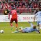 Kansas City's Aurelien Collin (centre) knocks the ball away from TFC's Tony Tchani