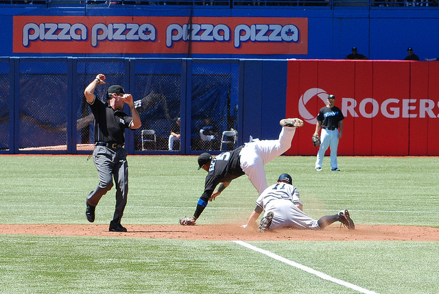 Yankee centre fielder Brett Gardner slides into second with a stolen base despite Yunel Escobar's acrobatic efforts Yankee centre fielder Brett Gardner slides into second with a stolen base despite Yunel Escobar's acrobatic efforts