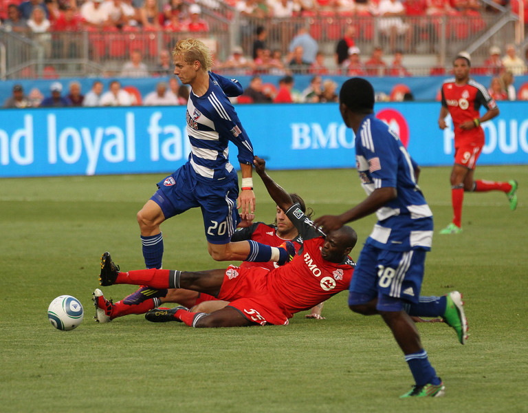 New TFC defender Eddy Viator drags down Dallas midfielder Brek Shea in the first half New TFC defender Eddy Viator drags down Dallas midfielder Brek Shea in the first half