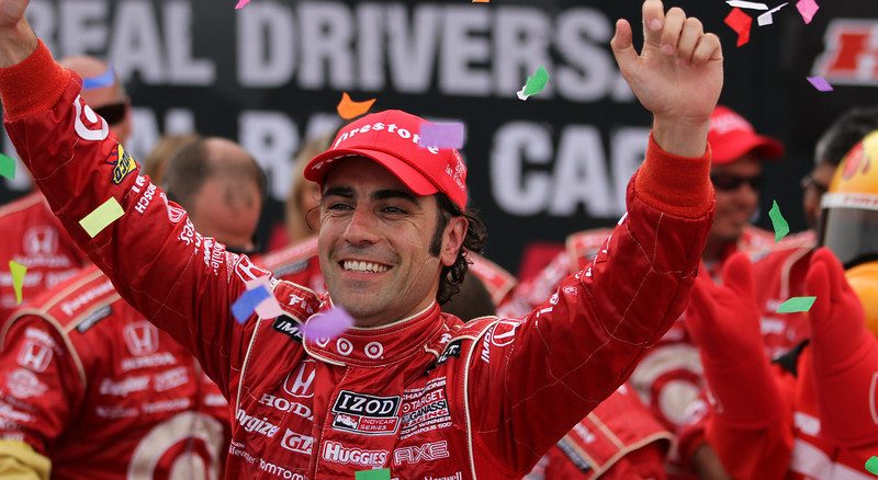 Dario Franchitti raises his arms in celebration after winning Honda Indy Toronto