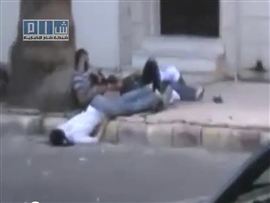 Amateur video released by the Shams News Network shows dead and injured bodies on the street in Homs on August 10. Amateur video released by the Shams News Network shows dead and injured bodies on the street in Homs on August 10.