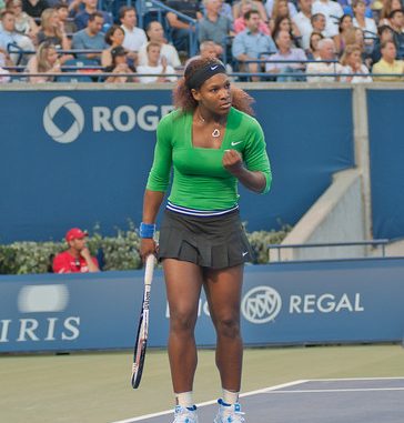 Serena Williams pumps her fist in celebration after winning a point in her semifinal match Saturday (John Lucero)