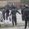 Afghan Policemen_carrying_the_body_of_a_suicide_attacker_in_Kabul_2
