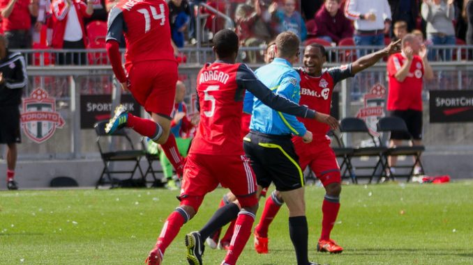 TFC striker Danny Koevermans (left) jumps up and does a fist pump in celebration of his first of two goals in the match (JP Dhanoa)