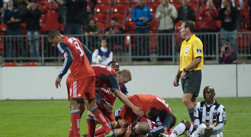 Toronto FC players jump on striker Danny Koevermans in celebration of his goal in the first half (John Lucero) Toronto FC players jump on striker Danny Koevermans in celebration of his goal in the first half (John Lucero)