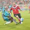 Canadian midfielder Ian Hume (left) avoids a tackle from St. Lucian defender Nathan Justin (right)
