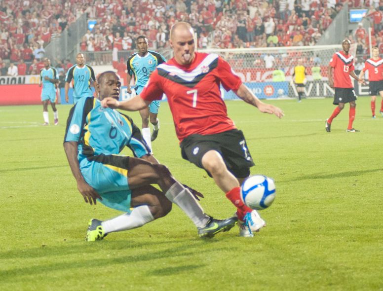 Canadian midfielder Ian Hume (left) avoids a tackle from St. Lucian defender Nathan Justin (right) Canadian midfielder Ian Hume (left) avoids a tackle from St. Lucian defender Nathan Justin (right)