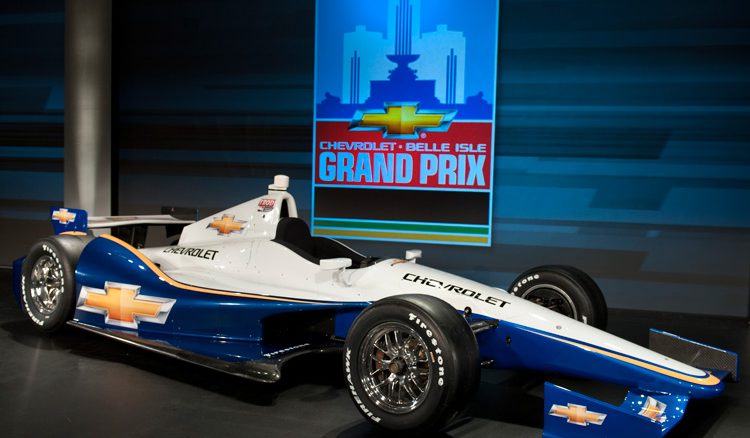 The all new 2012 Chevrolet IndyCar. New Detroit Grand Prix logo in background.
