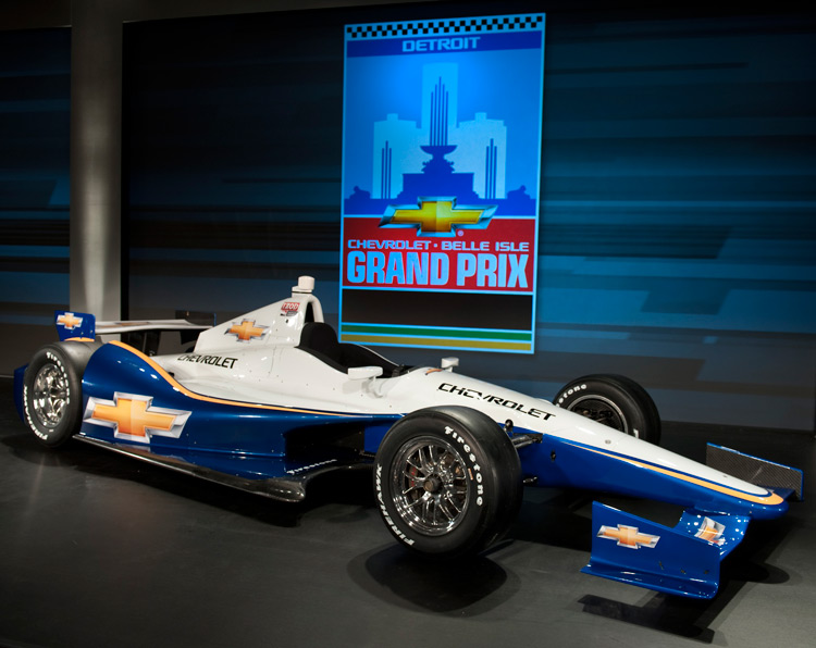 The all new 2012 Chevrolet IndyCar. New Detroit Grand Prix logo in background. The all new 2012 Chevrolet IndyCar. New Detroit Grand Prix logo in background.