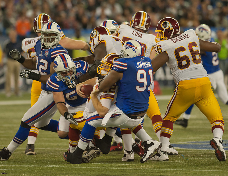 Washington Redskins quarterback John Beck is sacked by Buffalo Bills linebacker Danny Batten and defensive end Spencer Johnson at Rogers Centre Sunday (John Lucero) Washington Redskins quarterback John Beck is sacked by Buffalo Bills linebacker Danny Batten and defensive end Spencer Johnson at Rogers Centre Sunday (John Lucero)