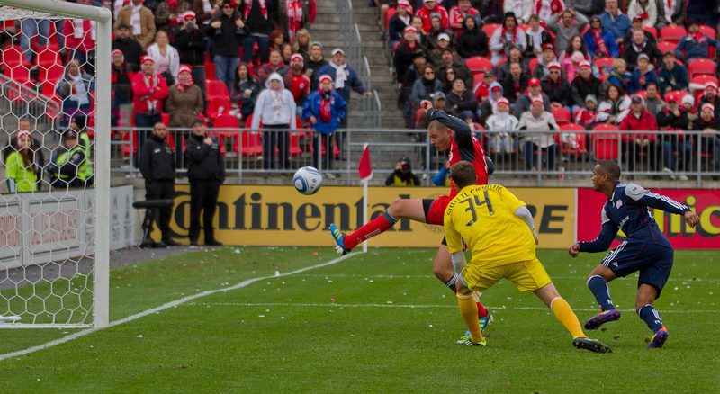 Revolution goalkeeper Bobby Shuttleworth and defender Darrius Barnes look on helplessly as TFC striker Danny Koevermans knocks in the game-tying goal (JP Dhanoa)