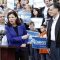 Mitt Romney looks on as Sen. Kelly Ayotte, R-N.H., endorse him outside City Hall in Nashua, N.H., Sunday, Nov. 20, 2011.