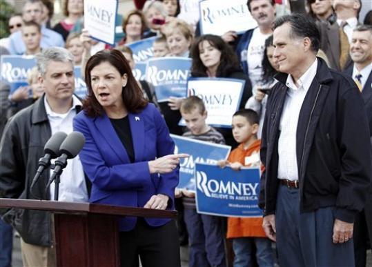 Mitt Romney looks on as Sen. Kelly Ayotte, R-N.H., endorse him outside City Hall in Nashua, N.H., Sunday, Nov. 20, 2011. Mitt Romney looks on as Sen. Kelly Ayotte, R-N.H., endorse him outside City Hall in Nashua, N.H., Sunday, Nov. 20, 2011.