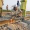 A man repairs destroyed railway track