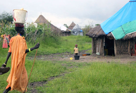 A woman in Pibor County walking home from her garden [©Gurtong]