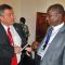 Unity State Governor Taban Deng Gai (right) confers with a guest at the ongoing Governors’ Forum in Juba. [©Gurtong]