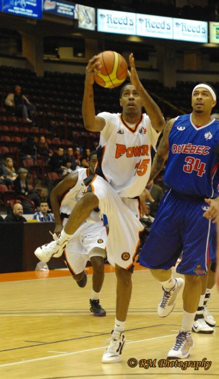 Oshawa Power guard drives to the net as Quebec Kebs forward James "Boo" Jackson looks on Oshawa Power guard drives to the net as Quebec Kebs forward James "Boo" Jackson looks on