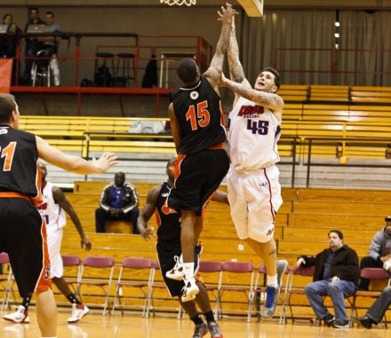 Oshawa Power guard Brandon Robinson jumps up to contest a shot from the Quebec Kebs
