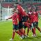 Josh Simpson is mobbed by teammates after scoring Canada's third goal scored just before the end of the first half on Tuesday night at BMO Field (John Lucero)