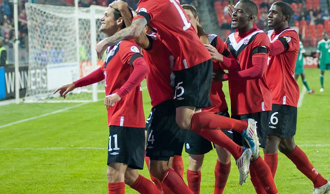 Josh Simpson is mobbed by teammates after scoring Canada's third goal scored just before the end of the first half on Tuesday night at BMO Field (John Lucero)
