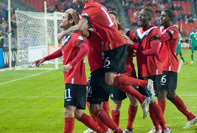 Josh Simpson is mobbed by teammates after scoring Canada's third goal scored just before the end of the first half on Tuesday night at BMO Field (John Lucero)