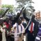 Angry students displaying the heavy metal chains they will use to close the embassy doors [©Gurtong]