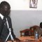 David Marial Gumke addressing parliamentarians as speaker John Marik (seated) listens [©Gurtong]