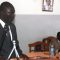 David Marial Gumke addressing parliamentarians as speaker John Marik (seated) listens [©Gurtong]