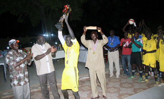 Gazal united football team wins the Lakes Governor Cup match as the captain raises the Trophy high [©Gurtong]