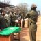 Governor Banagasi Joseph Bakosoro (wearing a suit) and other Prison officers awards certificates to the new prison warders [©Gurtong]