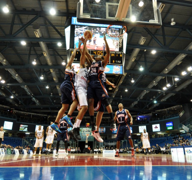 Summerside Storm guard Julian Allen (24) attempts to block a drive from the Saint John Millrats Summerside Storm guard Julian Allen (24) attempts to block a drive from the Saint John Millrats