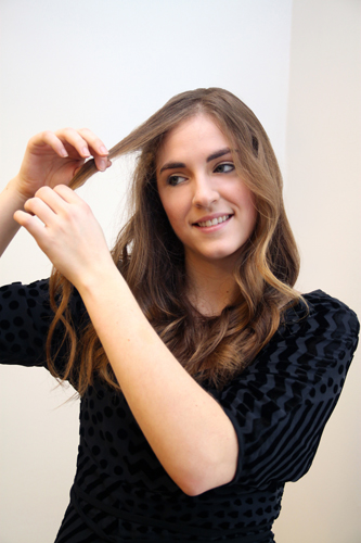 1. Start by taking a one-inch section of hair at your hairline and loosely pulling it forward. 1. Start by taking a one-inch section of hair at your hairline and loosely pulling it forward.
