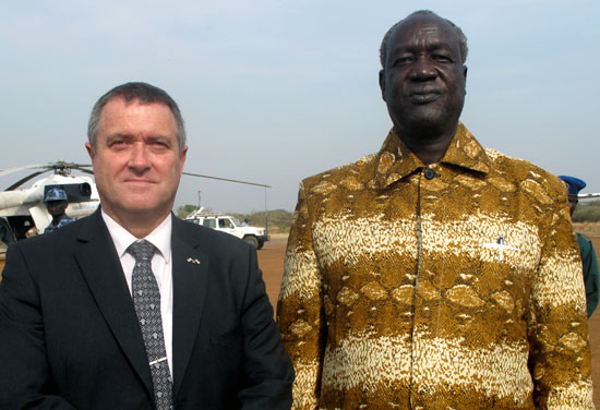 (L-R) Ambassador Alistair McHale pose with Jonglei Governor at Bor Air strip [©Gurtong]