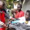 A Red Cross staff handing over boarding items to an Internaly displaced family at the Juba Hospital [©Gurtong]
