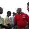Govoner Louis Lobong shaking hands with a section of youths in a past event at Torit freedom square football playground [©Gurtong]