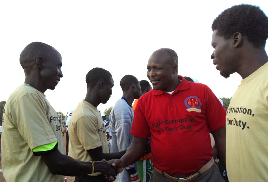 Govoner Louis Lobong shaking hands with a section of youths in a past event at Torit freedom square football playground [©Gurtong]