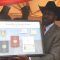 President Salva Kiir displays a sample of the national identity documents in Juba [©Gurtong]