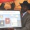 President Salva Kiir displays a sample of the national identity documents in Juba [©Gurtong]