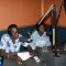 Some of the new “Voice of Freedom” radio station presenters reading news to listeners in Magwi County [©Gurtong]