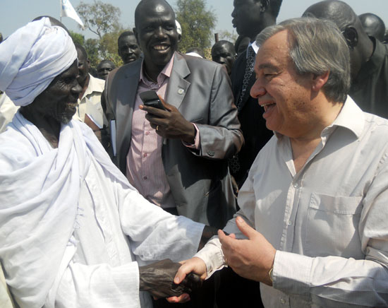 One of the refugees’ chiefs greeting the UNHCR boss while presenting their needs to him [©Gurtong]