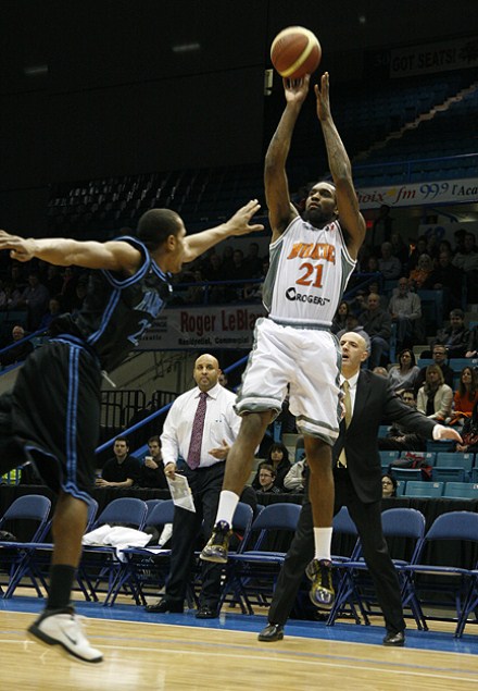 Moncton Miracles small forward Akeem Wright puts a jump shot over Halifax Rainmen shooting guard Lawrence Wright on Monday night at Moncton Coliseum. The Miracles won 102-91. Moncton Miracles small forward Akeem Wright puts a jump shot over Halifax Rainmen shooting guard Lawrence Wright on Monday night at Moncton Coliseum. The Miracles won 102-91.