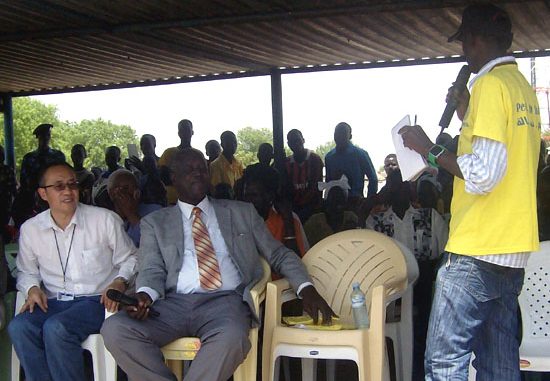 Mr. Moro Lokombu (standing) speaking to Governor Kuol Manyang Juuk at the Bor Freedom square during the World Radio day [©Gurtong]