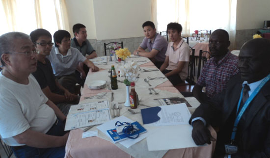 Mr. Zhang Jingxin (1st in left row) and Mr. Vermo Oduho Mamur (dressed in black suit) with other stakeholders during the meeting [©Gurtong]