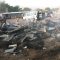 Affected traders sift through debris in the fire-ravaged Omoliha market in Torit [©Gurtong]