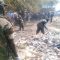 Uganda People’s Defence Force personnel cleaning Yambio market in commemoration of Army Week Day [©Gurtong]