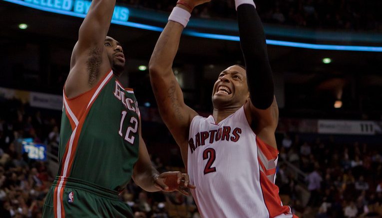 Toronto Raptors forward James Johnson (right) drives hard to the basket against Milwaukee Buck forward Luc Mbah a Moute on Wednesday night at the Air Canada Centre (JP Dhanoa)